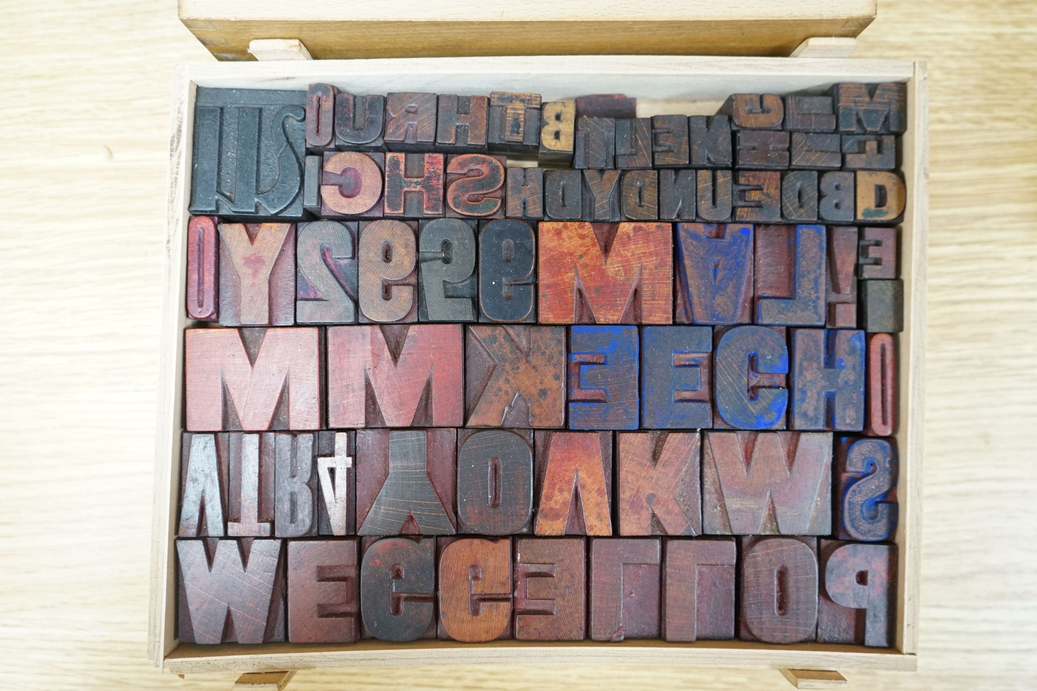 A collection metal letters and boxed printing blocks